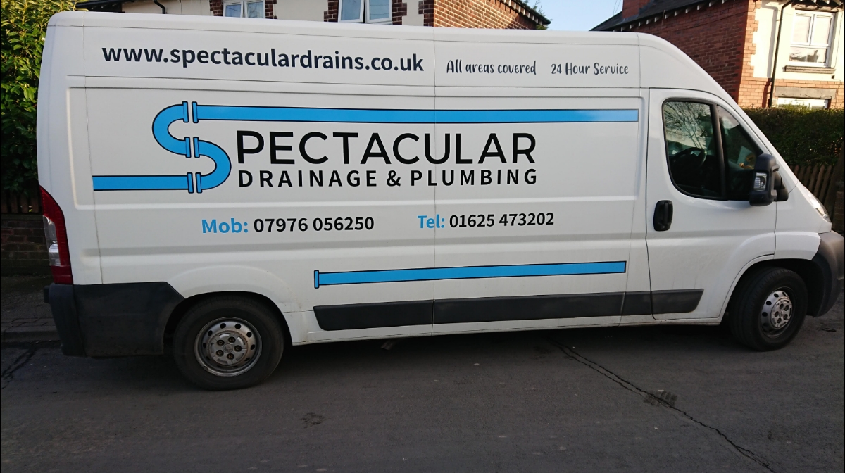 The Spectacular Drainage & Plumbing van, with the company name, phone numbers and 24 Hour Service on its side